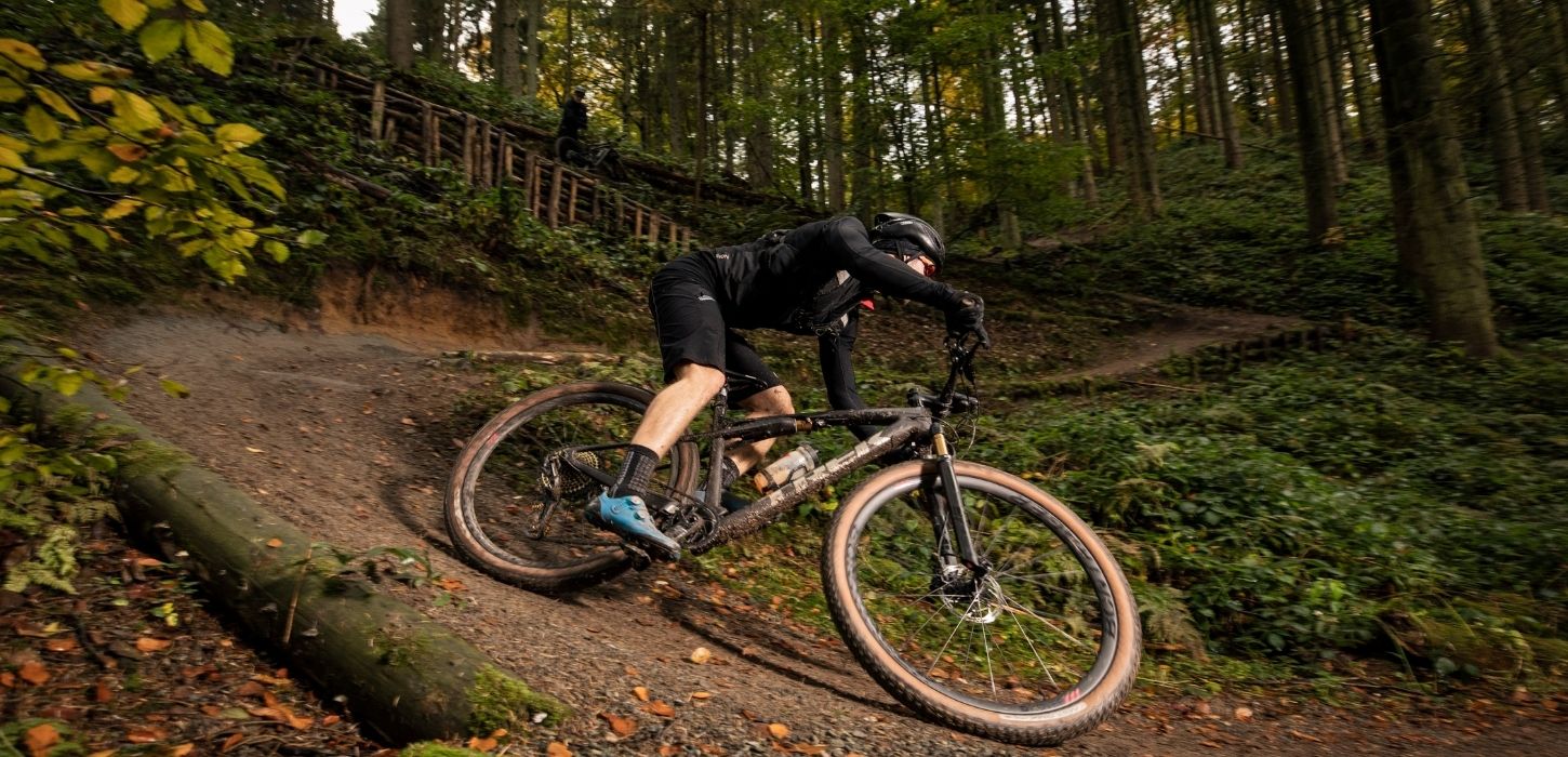 Cyclist on the way down the mountain bike hill in Nørreskoven Forest
