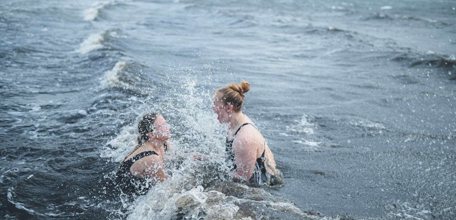 Two women take a winter bath at Tirsbæk Strand