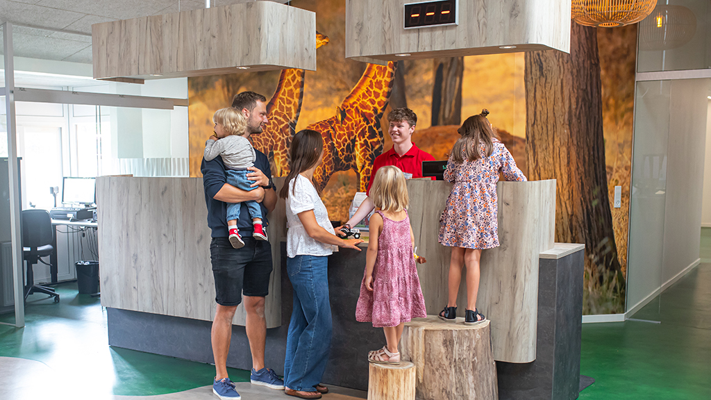 Family is guided by Givskud Zoo Tourist Information