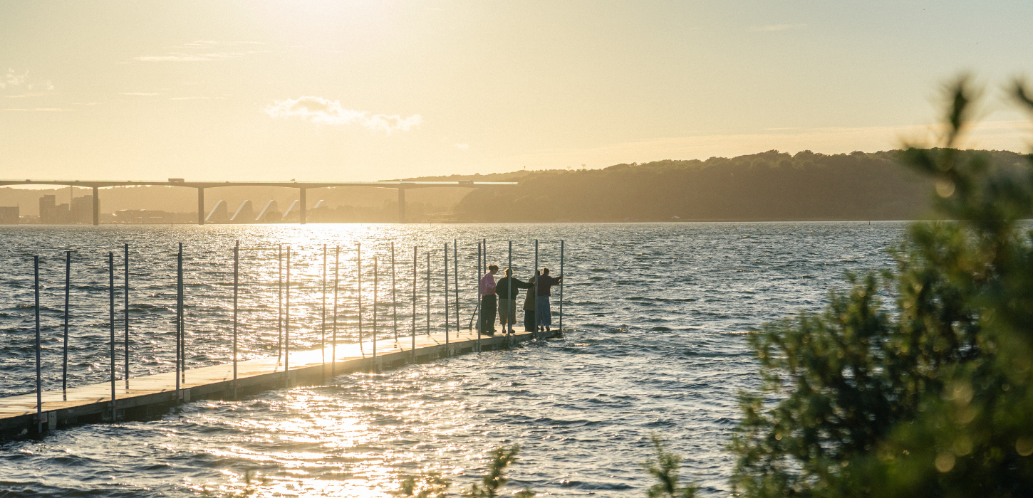 People on the bathing jetty at Ibæk Beach