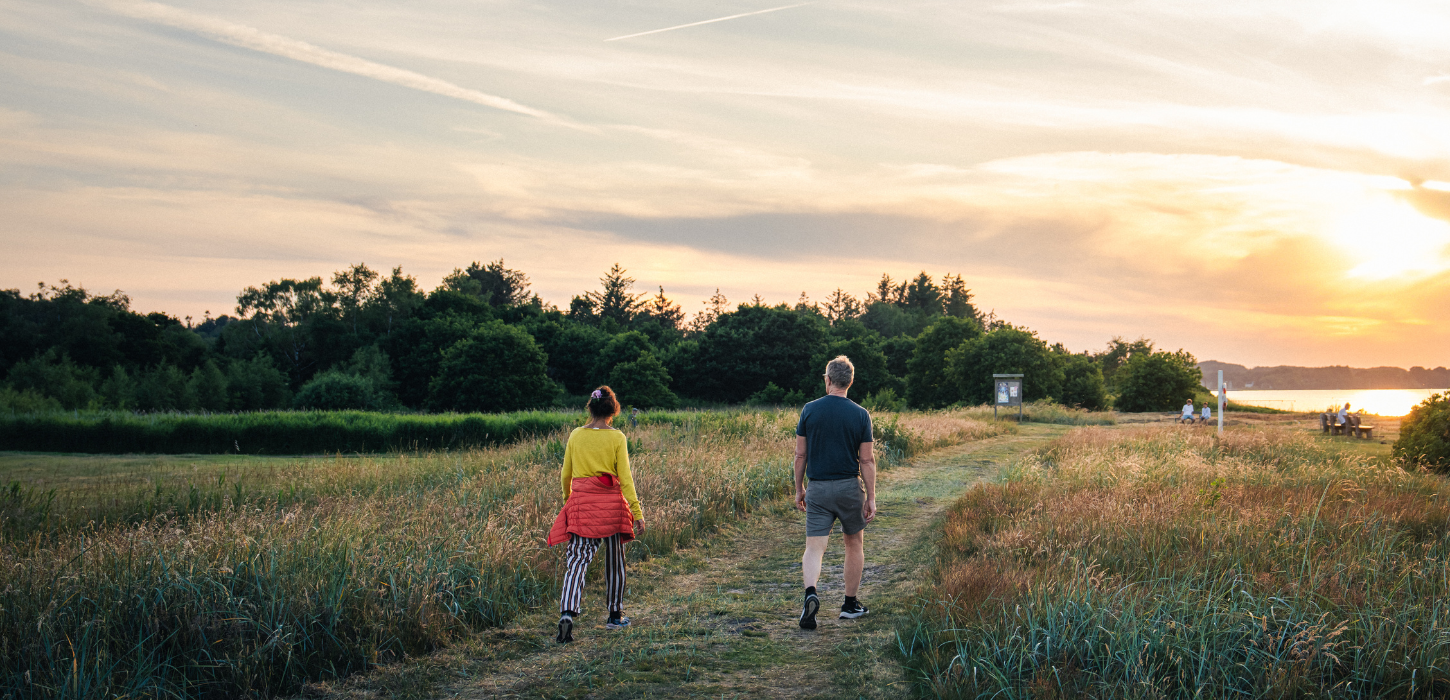 Couple walking in the evening at Mørkholt Strand