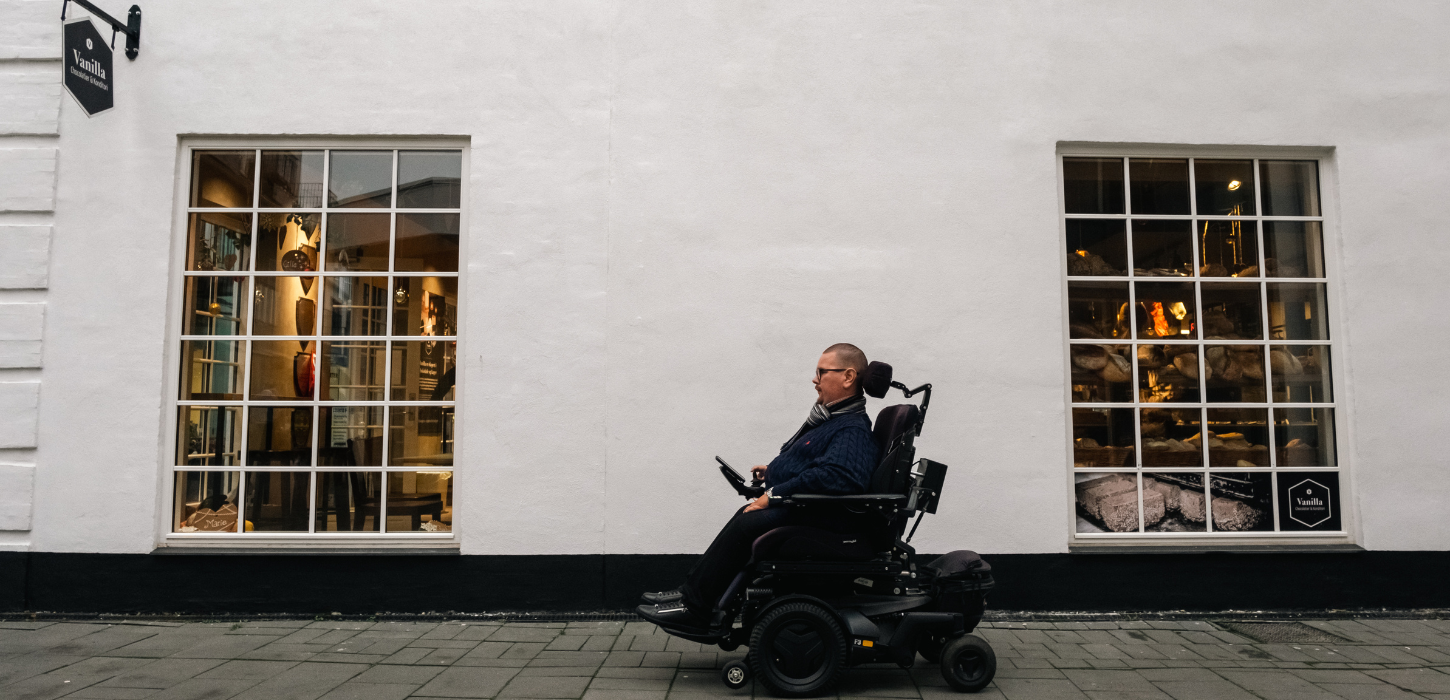 Wheelchair user in Vejle city centre at Paladspassagen