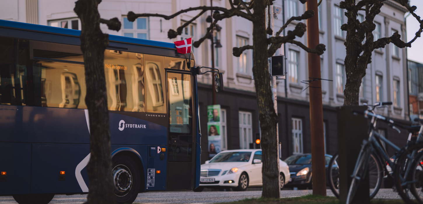 Buses and cars in Vejle city centre near the station
