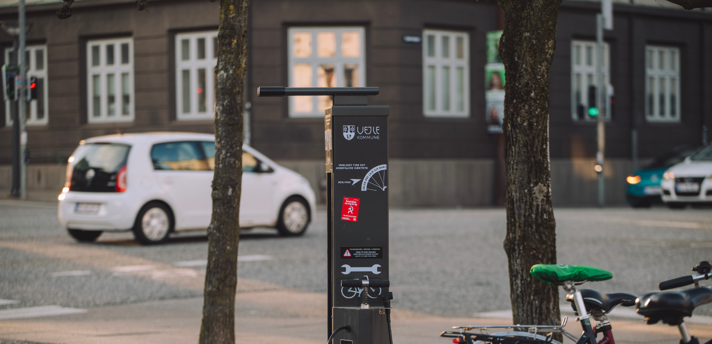 Bike racks and cars near Vejle Station