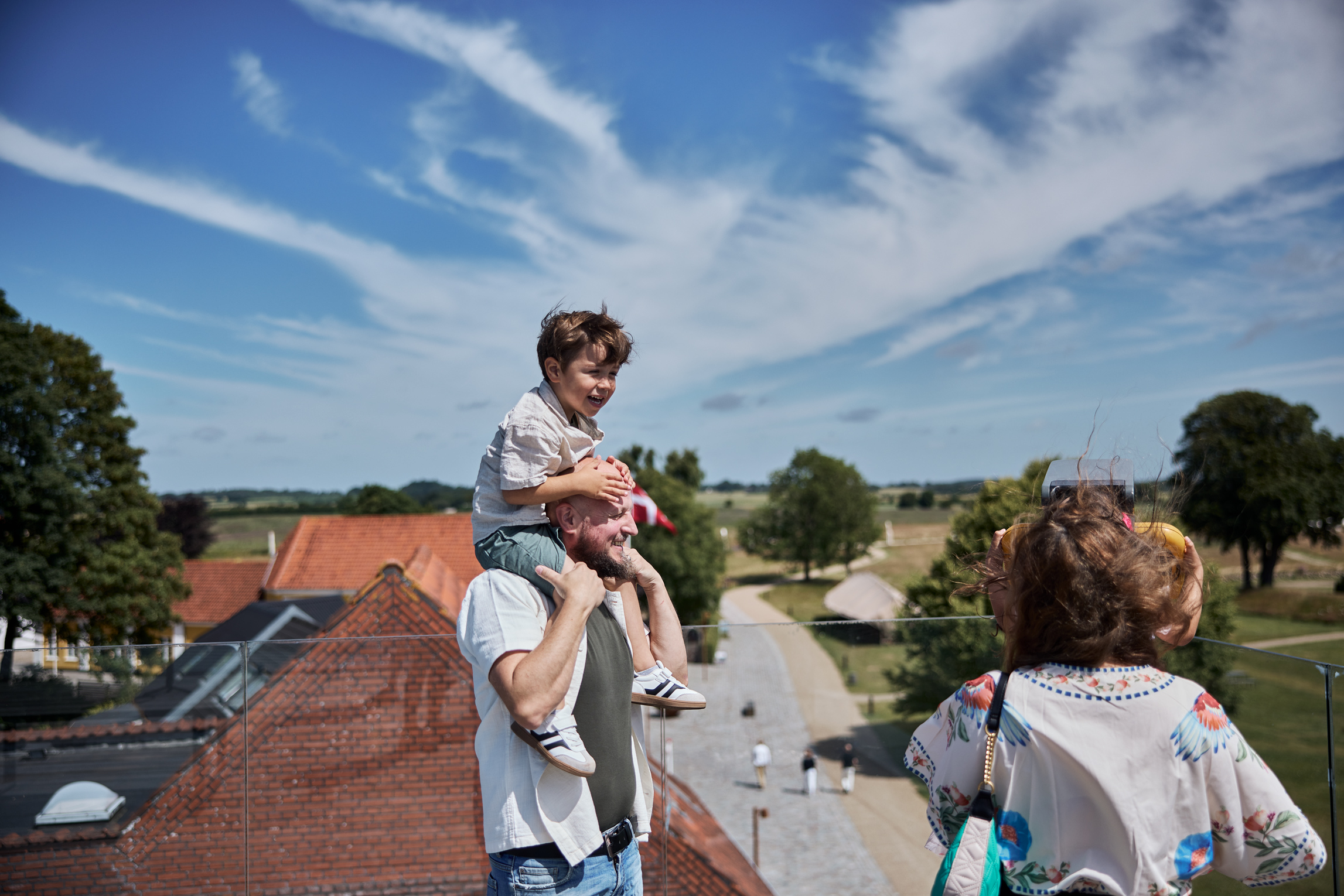 A family enjoying the view from the top at Kongernes Jelling