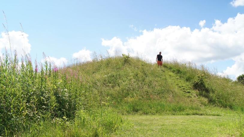 A person walks by The Grave of the Egtved Girl