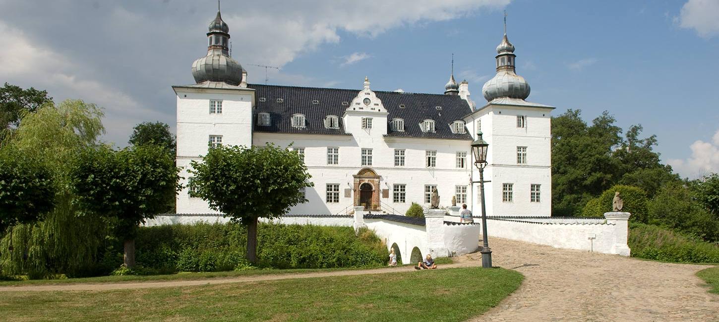 Engelsholm Castle by the moat on a summer day