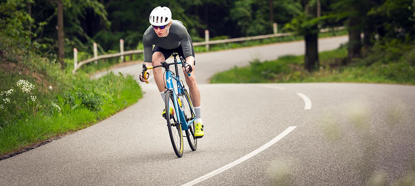 Road cyclist cycle down the Munkebjerg hill