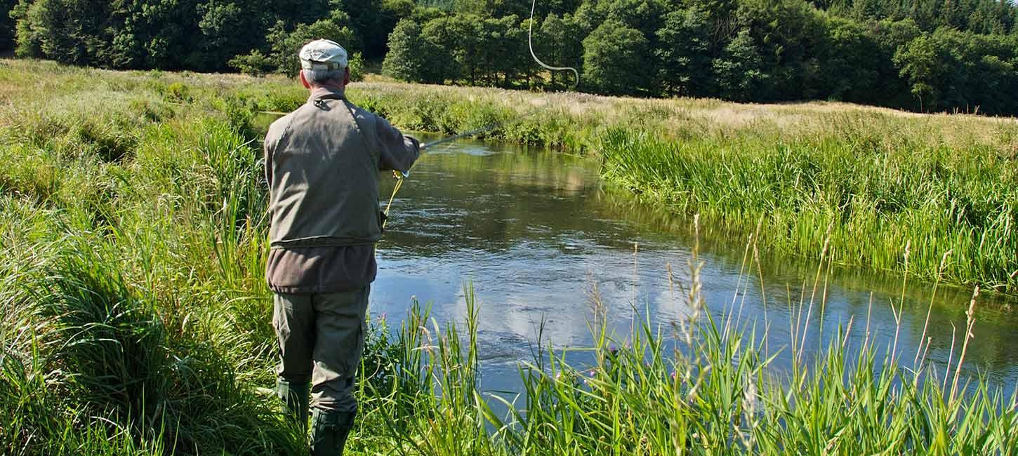 An angler on a fishing trip by Vejle Å