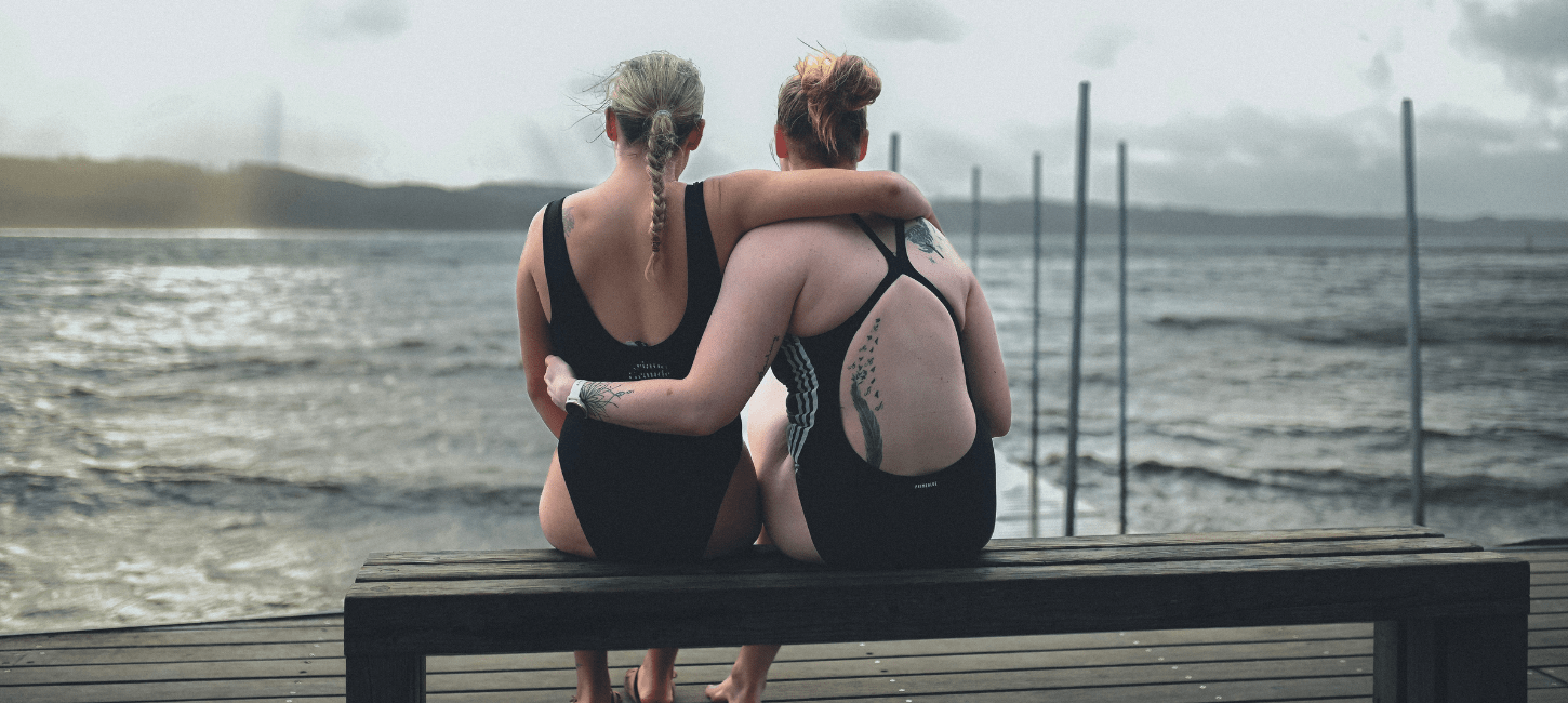 Two women on a bench going for a winter swim at Tirsbæk beach