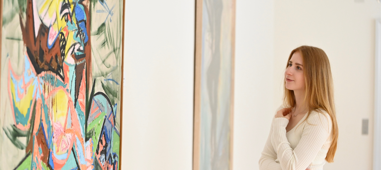 A visitor looks at art at the Vejle Art Museum