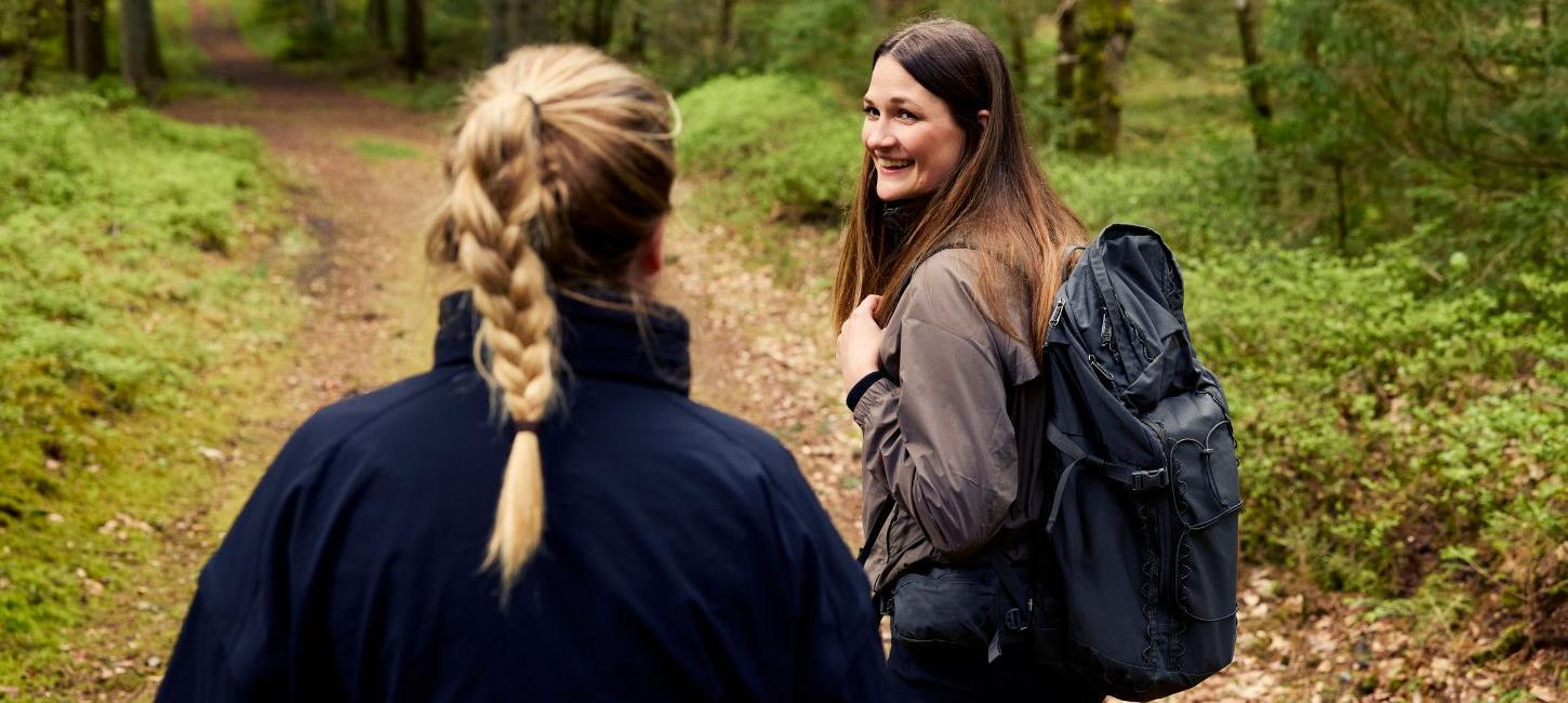 Two people are hiking along Hærvejen