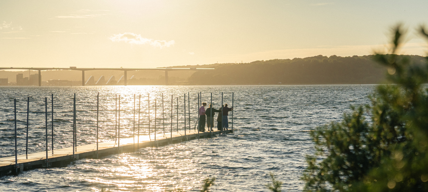People on the bathing jetty at Ibæk Beach