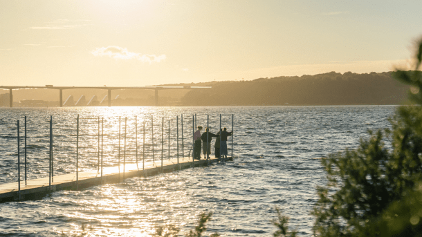 People on the bathing jetty at Ibæk Beach
