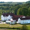 View of Haraldskær Sinatur Hotel and Conference on a summer day