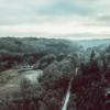 Drone image of Grejsdalen, where the fog comes in over the valley