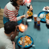 Friends eat together at Paladspassagen Social Dining