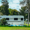A caravan is parked by Fårup Lake near Jelling