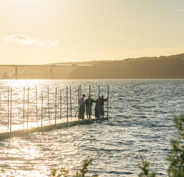 People on the bathing jetty at Ibæk Beach