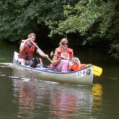 Family canoeing on Skjern Å