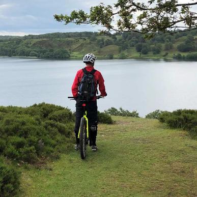 Mountain biker with a view of a lake