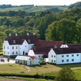 View of Haraldskær Sinatur Hotel and Conference on a summer day