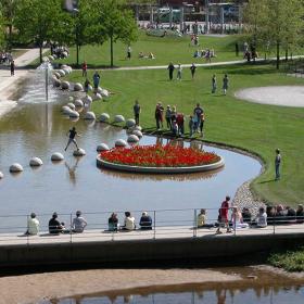 People are in the Byparken city park in Vejle on a summer day