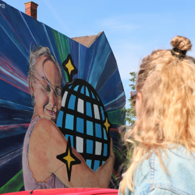 Person looks at street art in Vejle city centre