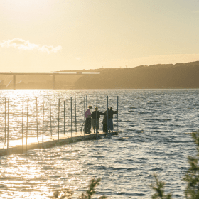People on the bathing jetty at Ibæk Beach