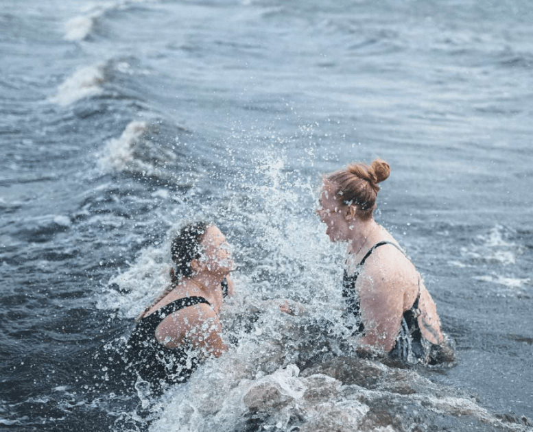 Two women take a winter bath at Tirsbæk Strand
